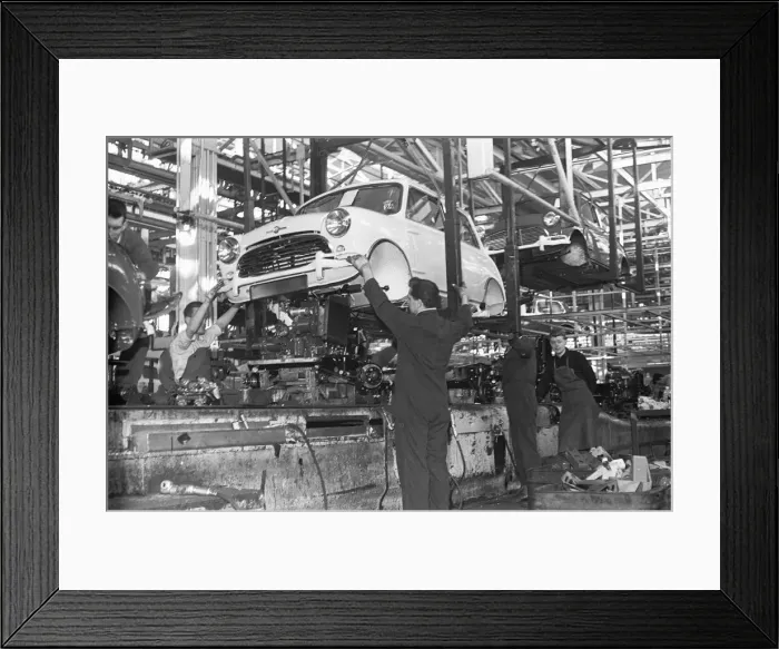 Framed Print : The engine is fitted to a Austin Mini on the production line, Longbridge. 10th March 1963 Framed Print : The engine is fitted to a Austin Mini on the production line, Longbridge. 10th March 1963