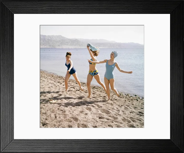 Framed Print : Group of friends enjoying themselves during a day out at the seaside in Greece Framed Print : Group of friends enjoying themselves during a day out at the seaside in Greece