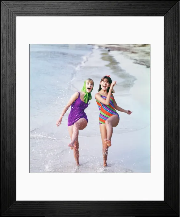 Framed Print : Group of friends enjoying themselves during a day out at the seaside in Greece