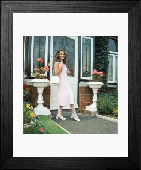 Framed Print : Dress designer Glynis Robins, 23, pictured wearing one of her own designs - a midi dress Framed Print : Dress designer Glynis Robins, 23, pictured wearing one of her own designs - a midi dress