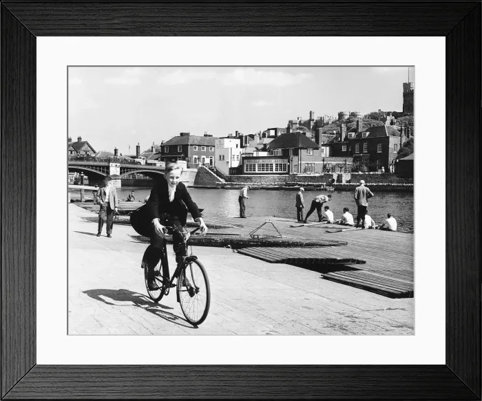 Framed Print : Eton schoolboy cycling along the Thames in his school uniform Circa 1955 Framed Print : Eton schoolboy cycling along the Thames in his school uniform Circa 1955