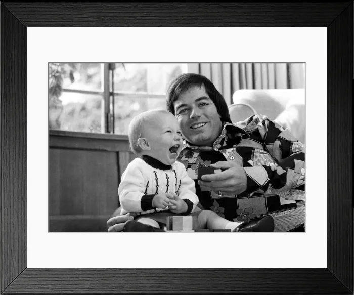 Framed Print : Tony Blackburn at home in Cookham Dean, Berkshire, with his son Simon. 5th September 1974 Framed Print : Tony Blackburn at home in Cookham Dean, Berkshire, with his son Simon. 5th September 1974