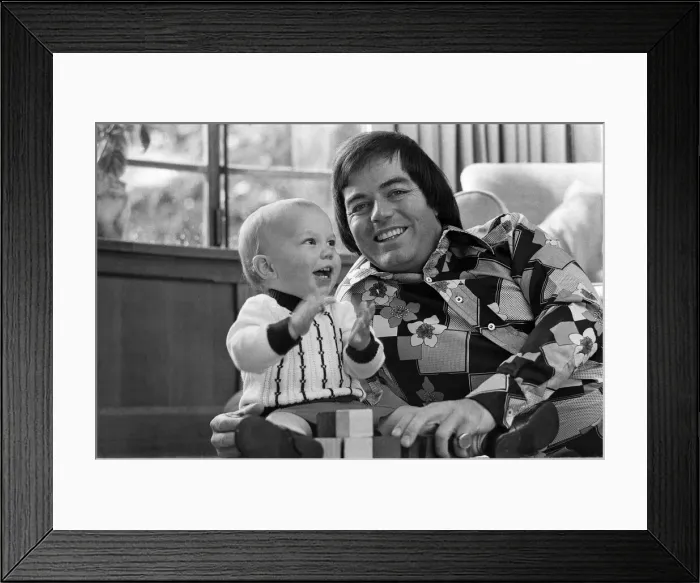 Framed Print : Tony Blackburn at home in Cookham Dean, Berkshire, with his son Simon. 5th September 1974 Framed Print : Tony Blackburn at home in Cookham Dean, Berkshire, with his son Simon. 5th September 1974