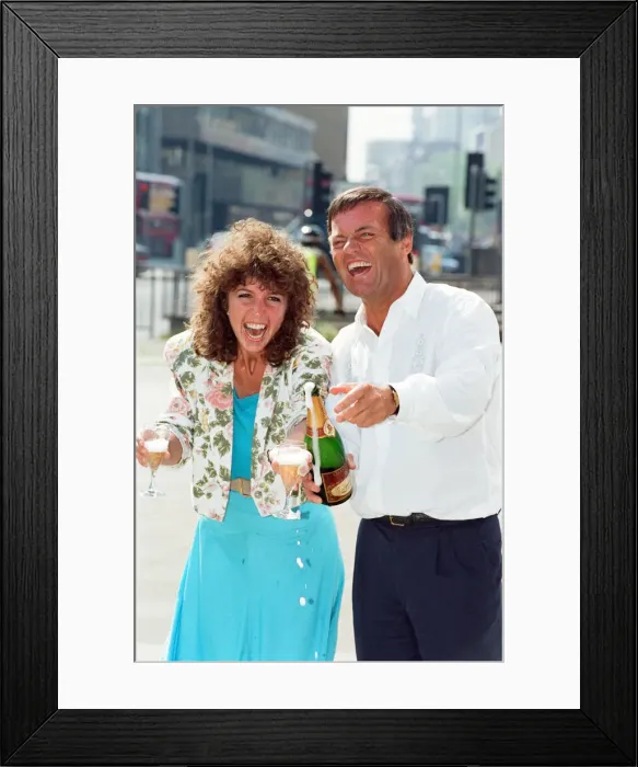 Framed Print : DJ Tony Blackburn and Debbie Thomson celebrate their engagement. 29th July 1991 Framed Print : DJ Tony Blackburn and Debbie Thomson celebrate their engagement. 29th July 1991