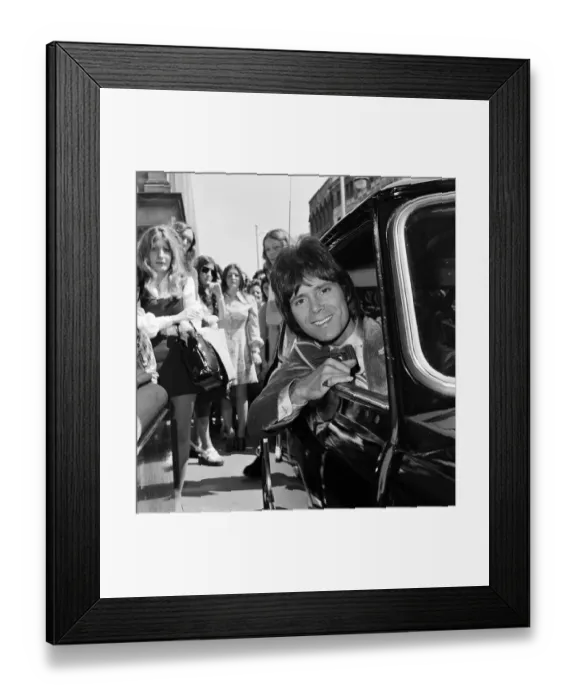 Framed Print : Cliff Richard leaving a Birmingham hotel for location work on his latest film