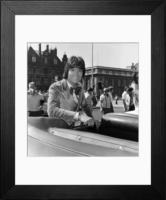 Framed Print : Cliff Richard leaving a Birmingham hotel for location work on his latest film Framed Print : Cliff Richard leaving a Birmingham hotel for location work on his latest film