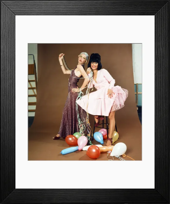 Framed Print : Christmas party fashions, modelled by Helen and Monique. Helen, left, wears £14