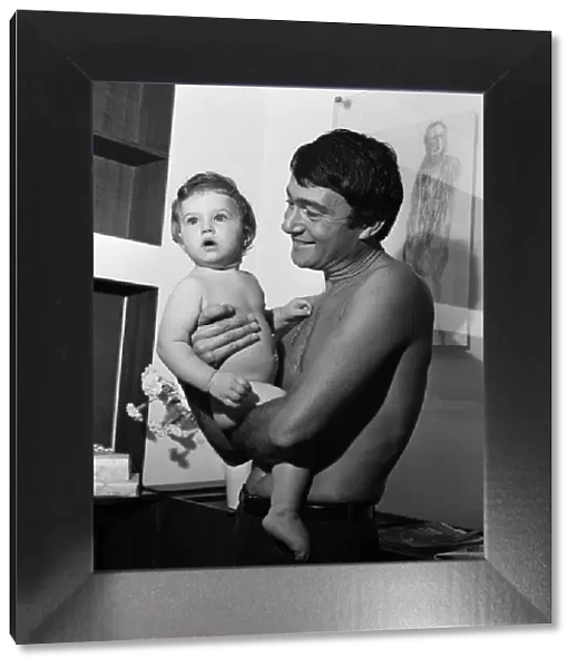 Hairstylist Vidal Sassoon and his one year old daughter Catya, pictured in his flat