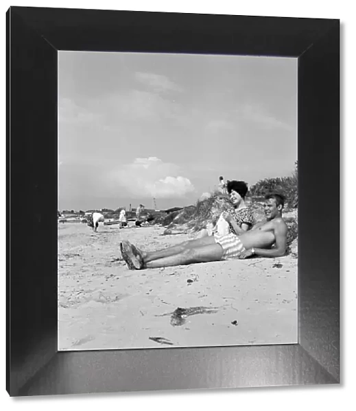 Pop singer Marty Wilde and his 19-year-old wife Joyce on the beach at Shell Bay, Dorset