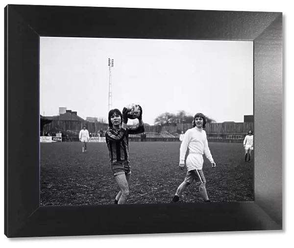 Cliff Richard playing football at a charity football match at Southall. 1st January 1973