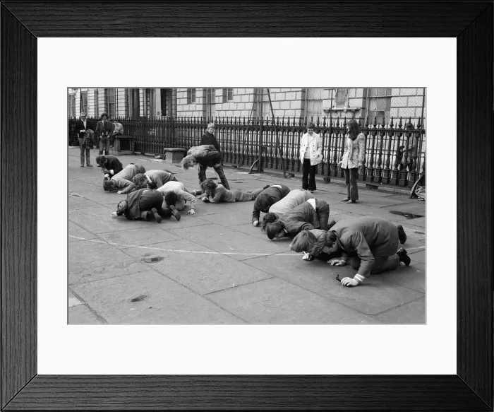 Framed Print : Students and young people taking part in a pea pushing contest for the charity Framed Print : Students and young people taking part in a pea pushing contest for the charity