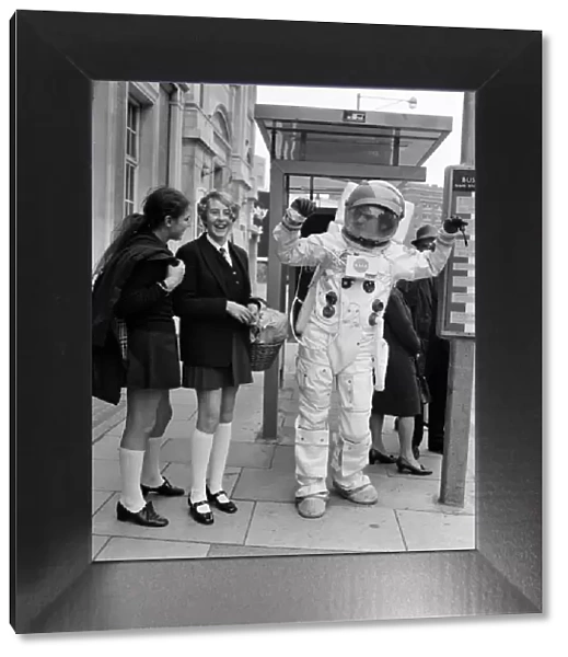 Spaceman in London streets. Jonathan Bosley, dressed in a space man suit as used by