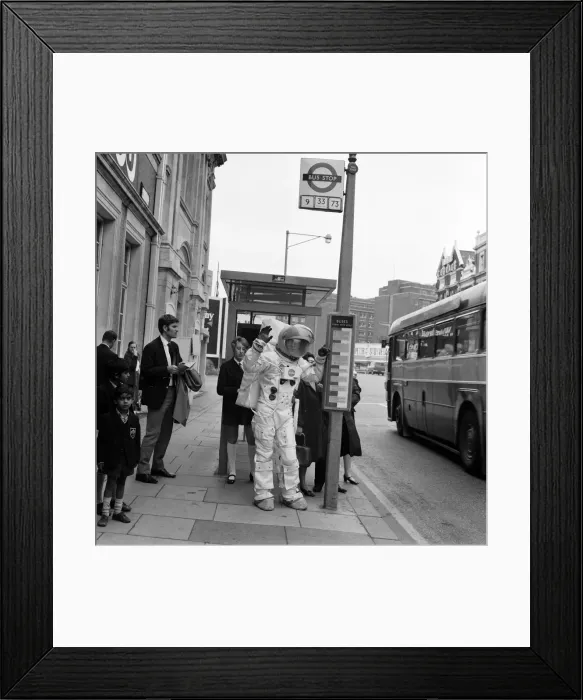 Framed Print : Spaceman in London streets. Jonathan Bosley, dressed in a space man suit as used by Framed Print : Spaceman in London streets. Jonathan Bosley, dressed in a space man suit as used by