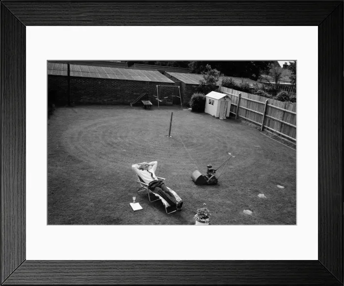 Framed Print : Automatic grass cutting. BOAC pilot Pat Alley demonstrating his mowing method in his Framed Print : Automatic grass cutting. BOAC pilot Pat Alley demonstrating his mowing method in his
