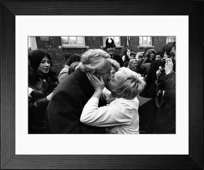 Framed Print : Shop assistant Jennifer Holland interrupted Howard Wilson