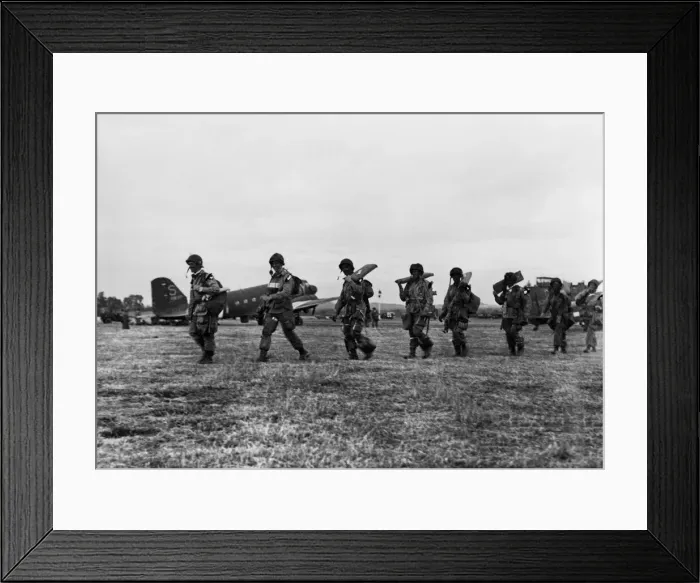 Framed Print : American paratroopers file along with full equipment to board their transport for Framed Print : American paratroopers file along with full equipment to board their transport for