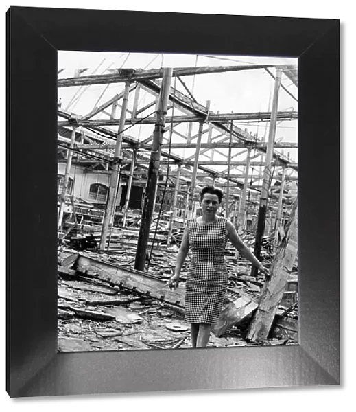 Miss Eileen Harris standing in the rubble which was once St. Johns Market, Liverpool