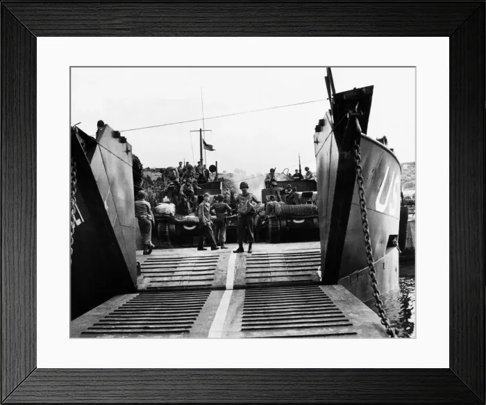 Framed Print : A U.s army loadmaster seen here directing load operations of American armour on to a Framed Print : A U.s army loadmaster seen here directing load operations of American armour on to a