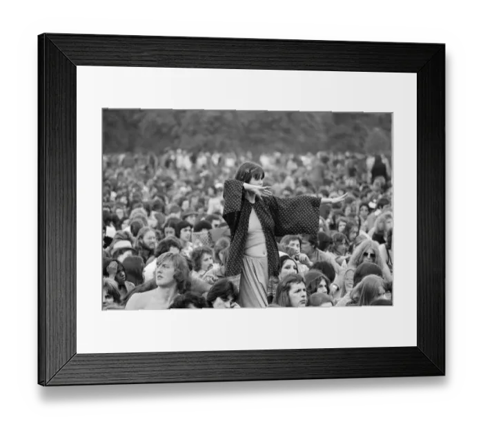 Framed Print : Picture shows a fan dancing amongst the huge audience at London Hyde Park for a concert