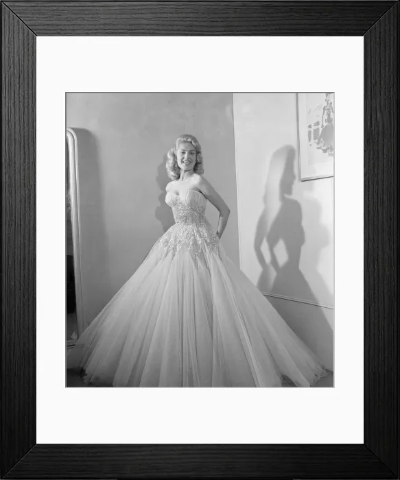 Framed Print : Belinda Lee, British actress tries on dress designed by Julie Harris Framed Print : Belinda Lee, British actress tries on dress designed by Julie Harris