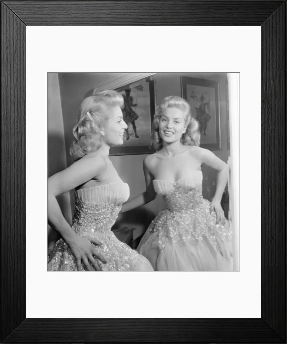 Framed Print : Belinda Lee, British actress tries on dress designed by Julie Harris