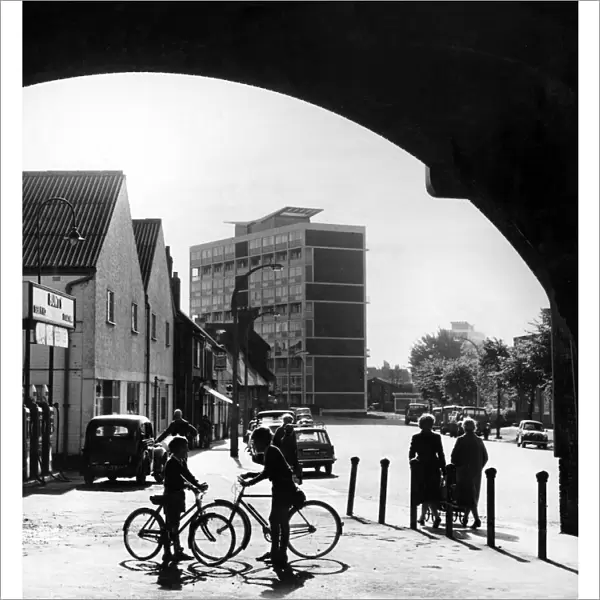 A sunny morning at Spon End, Coventry, with the railway bridge framing modern blocks of