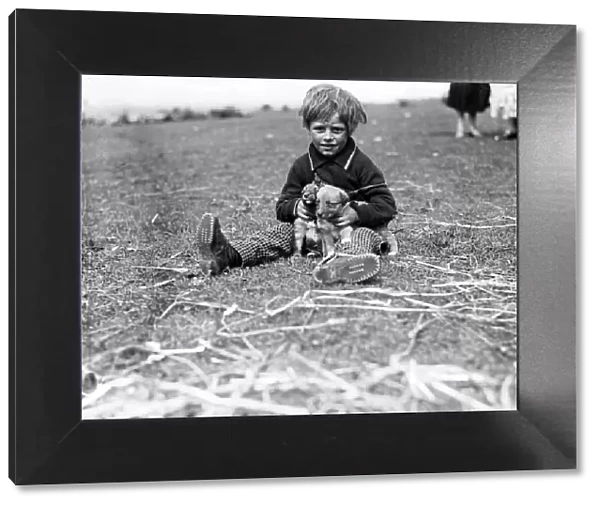 Gipsy child and pet dog at Epsom Downs, Surrey. 1932