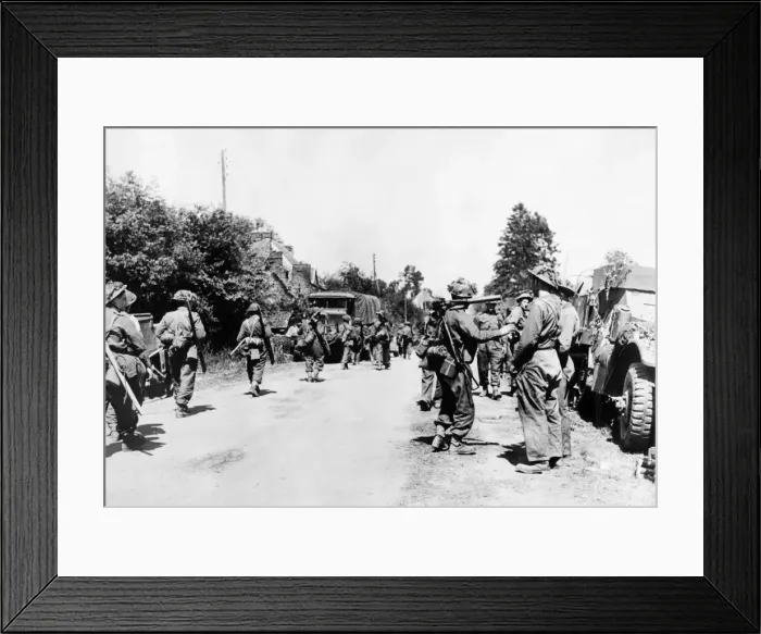 Framed Print : British troops about to pass through Normandy village after the landings Framed Print : British troops about to pass through Normandy village after the landings