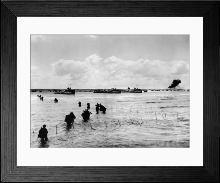 Framed Print : A long line of U.s army men wade through shallow water off northern coast of France to Framed Print : A long line of U.s army men wade through shallow water off northern coast of France to