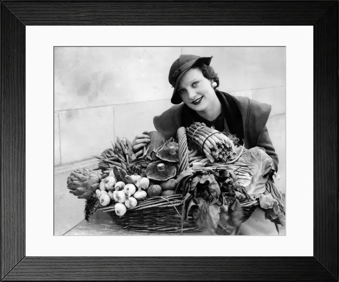 Framed Print : A woman with a selection of in season garden produce. 20th May 1934 Framed Print : A woman with a selection of in season garden produce. 20th May 1934