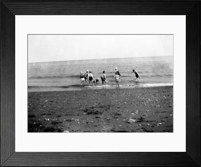 Framed Print : Children having fun in the sea at an unknown beach in England. Circa 1929 Framed Print : Children having fun in the sea at an unknown beach in England. Circa 1929