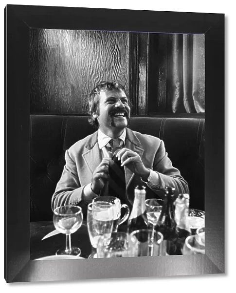 Oliver Reed, British actor, enjoys a few drinks at his local pub, The Dog and Fox