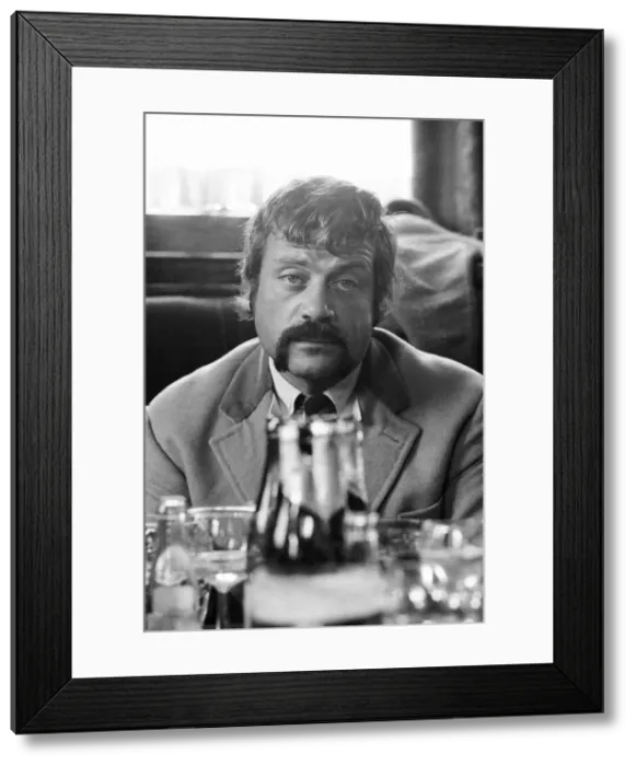 Framed Print : Oliver Reed, British actor, enjoys a few drinks at his local pub, The Dog and Fox Framed Print : Oliver Reed, British actor, enjoys a few drinks at his local pub, The Dog and Fox