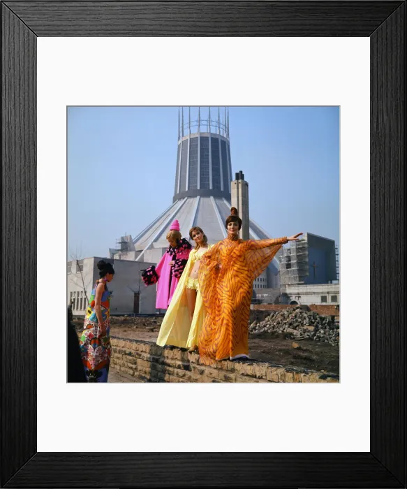 Framed Print : Fashion show in Liverpool. L-R Zandra Fisher, wearing a pink silk coat trimmed with pink Framed Print : Fashion show in Liverpool. L-R Zandra Fisher, wearing a pink silk coat trimmed with pink