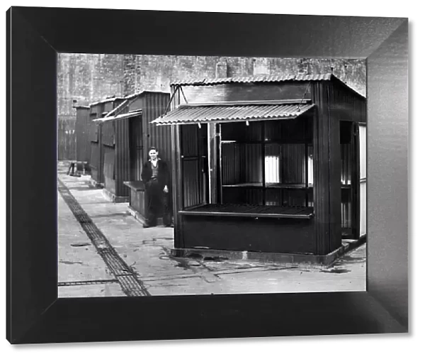 Some of the prefabricated stalls which are being erected in the shell of the blitzed