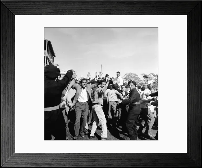 Framed Print : Suez Crisis 1956 Crowds of angry Egyptians are held back by police as United