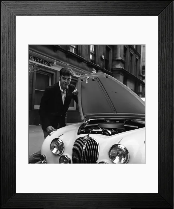 Framed Print : Pop star Marty Wilde, 22, is given a parking ticket after parking his cream Jaguar Framed Print : Pop star Marty Wilde, 22, is given a parking ticket after parking his cream Jaguar