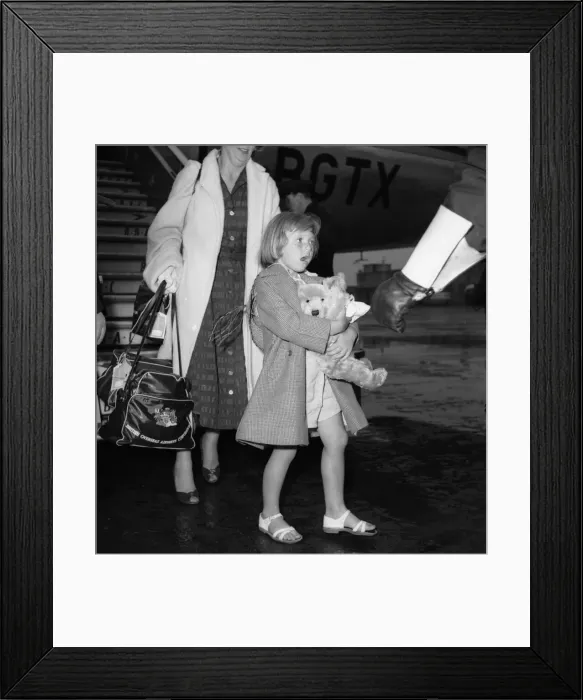 Framed Print : Suez Crisis 1956 British civillians return to a wet United Kingdom after leaving Framed Print : Suez Crisis 1956 British civillians return to a wet United Kingdom after leaving