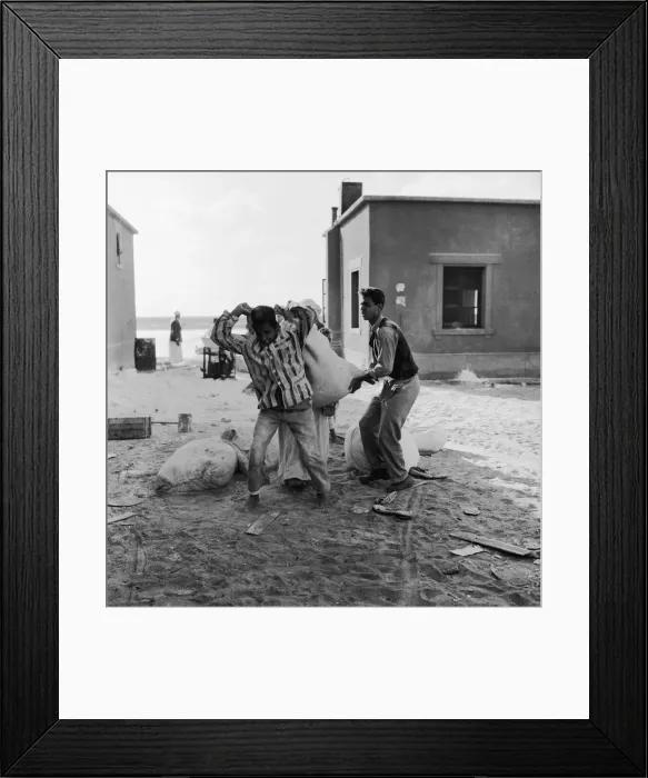 Framed Print : Suez Crisis 1956 Children carry off the leftovers after adults raided Framed Print : Suez Crisis 1956 Children carry off the leftovers after adults raided
