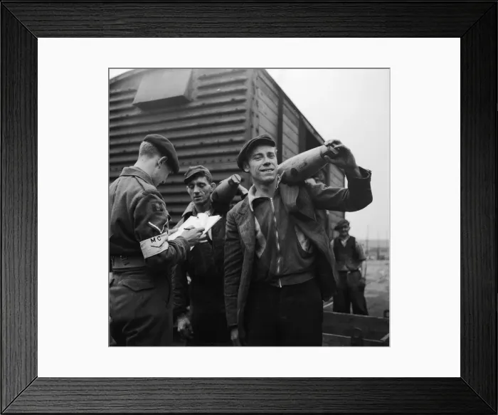 Framed Print : Suez Crisis 1956 Dockers putting 80lb shells into crates marked Framed Print : Suez Crisis 1956 Dockers putting 80lb shells into crates marked