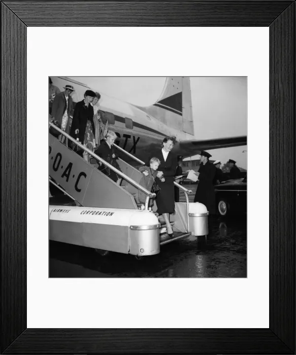 Framed Print : Suez Crisis 1956 British civillians return to a wet United Kingdom after leaving Framed Print : Suez Crisis 1956 British civillians return to a wet United Kingdom after leaving