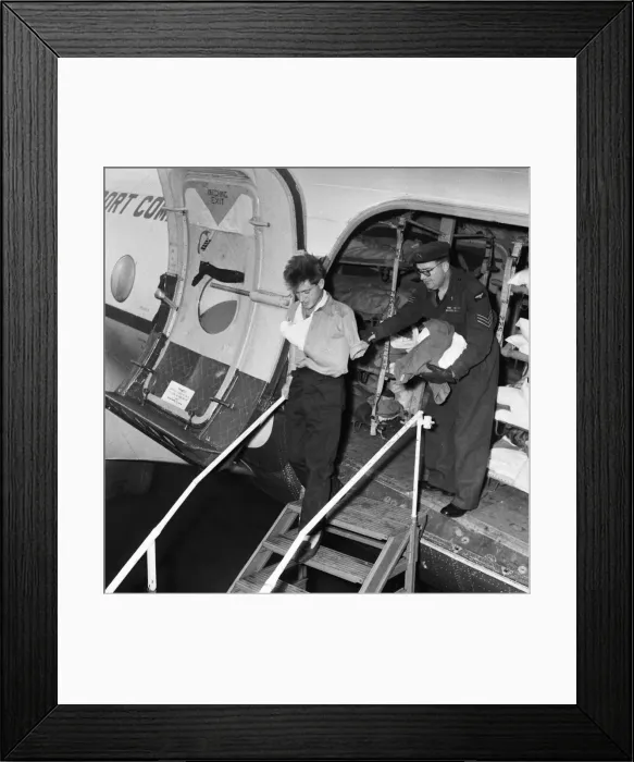 Framed Print : Suez Crisis 1956 A wounded British soldier is helped off an ambulance aircraft Framed Print : Suez Crisis 1956 A wounded British soldier is helped off an ambulance aircraft