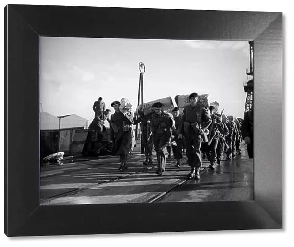 Suez Crisis 1956 Troops walking along quay after having disembarked from '