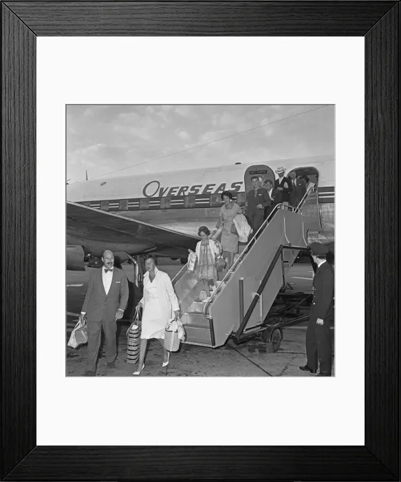 Framed Print : Passengers disembarking from an Overseas Aviation charter flight from the continent to Framed Print : Passengers disembarking from an Overseas Aviation charter flight from the continent to