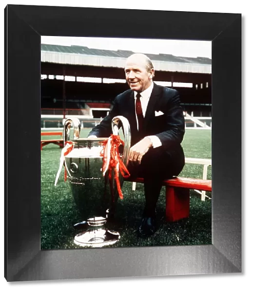 Sir Matt Busby manager of Manchester United poses at a pres season photocall with