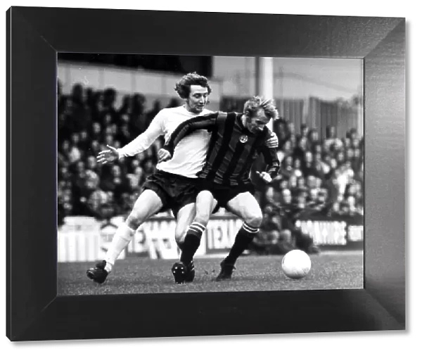 Dennis Law December 1973 of Manchester United (R) in action with Spurs Terry Naylor