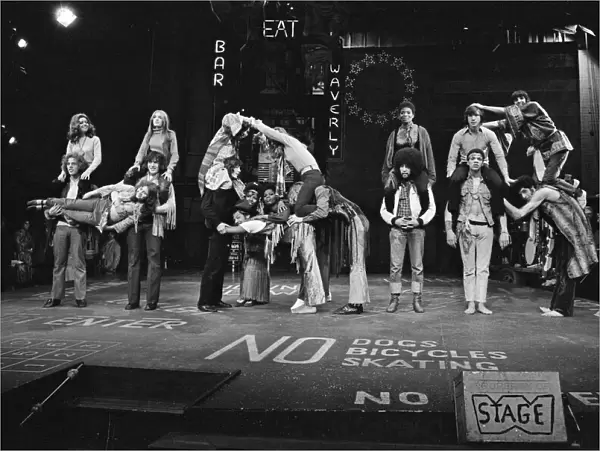 Picture shows the cast of Hair, The Musical. Far left is actor