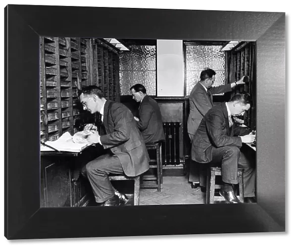 Finger Print Department. Section of search room, officers searching records