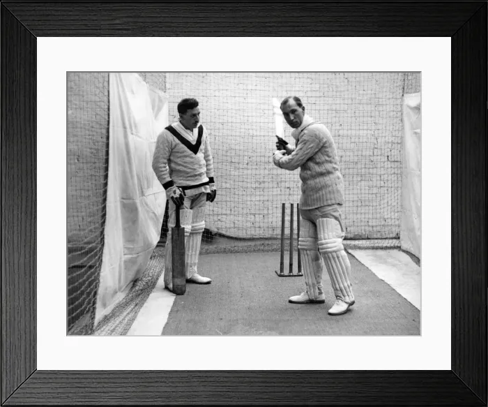 Framed Print : Sandham demonstrating a batting stroke to a pupil at the indoor cricket school opened Framed Print : Sandham demonstrating a batting stroke to a pupil at the indoor cricket school opened