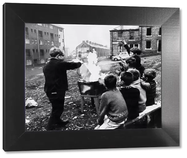 Young boys starting a fire in Beaumont Street, Newcastle Upon Tyne